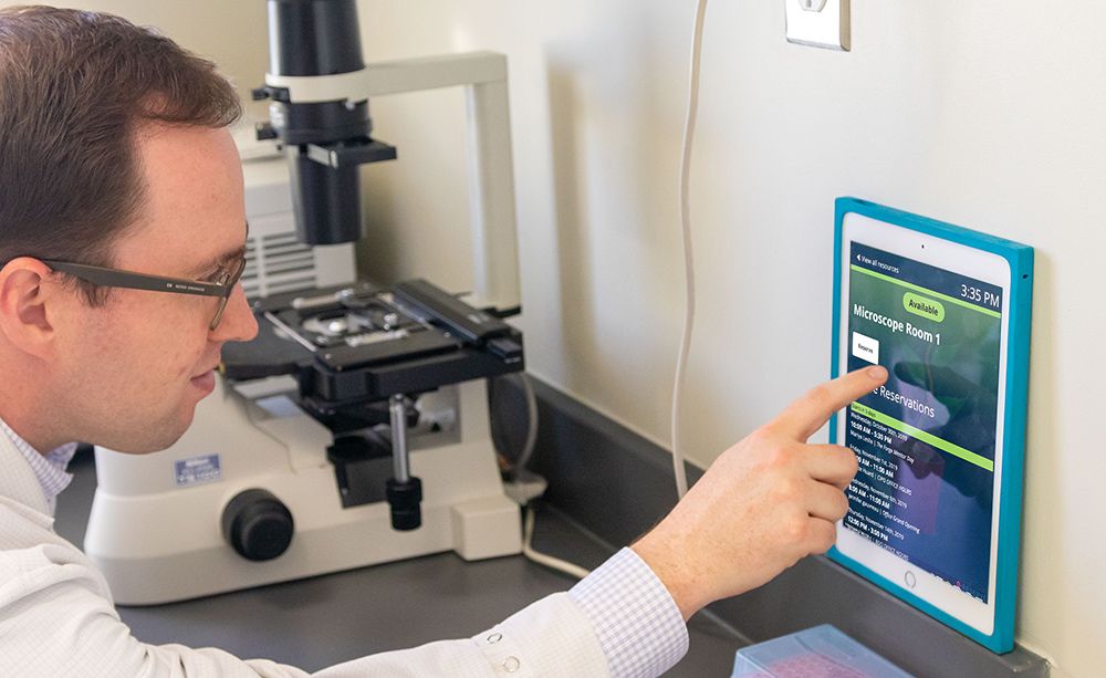 person using QReserve on a tablet