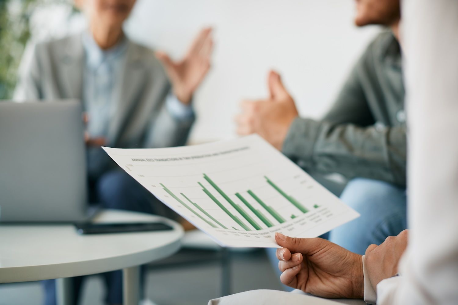 people looking at a report